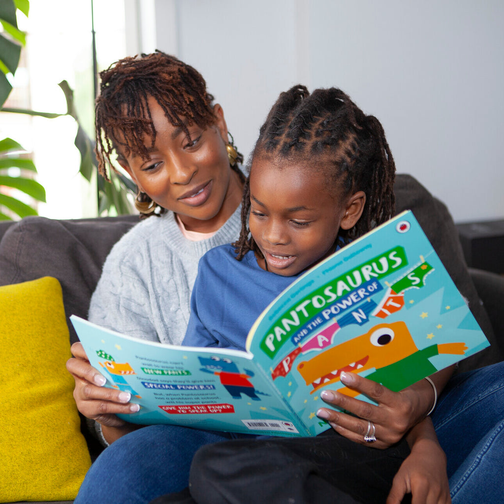 A mother and child reading the Pantosaurus and the Power of Pants Picture Book. 