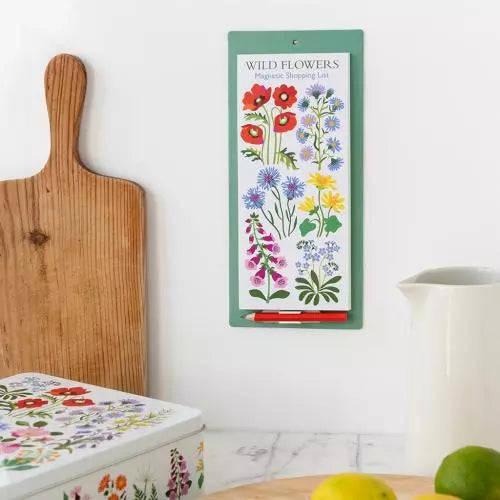 Wild Flower Magnetic Shopping List hung up on a kitchen wall.