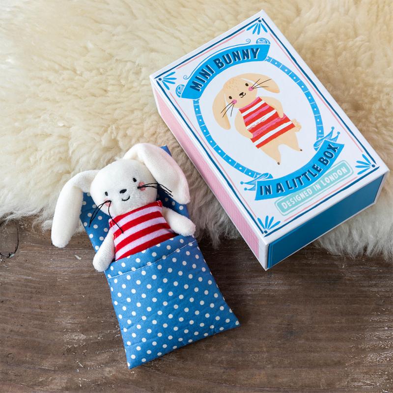 Matchbox with cartoon bunny on the front, alongside mini bunny teddy in a sleeping bag. 