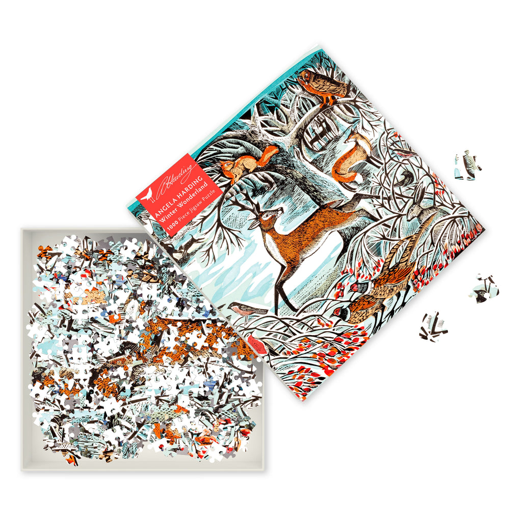 Jigsaw puzzle with deer design on packaging and scattered pieces on a white background