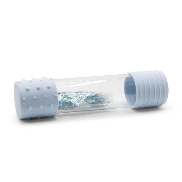 Clear tube with blue and white contents on a white background