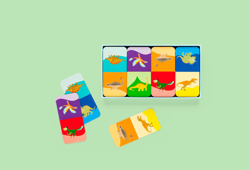 Set of colorful children's flashcards with dinosaur illustrations on a light green background