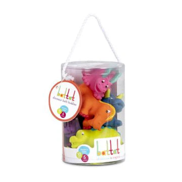 Set of colorful bath buddies in a clear plastic container on a white background