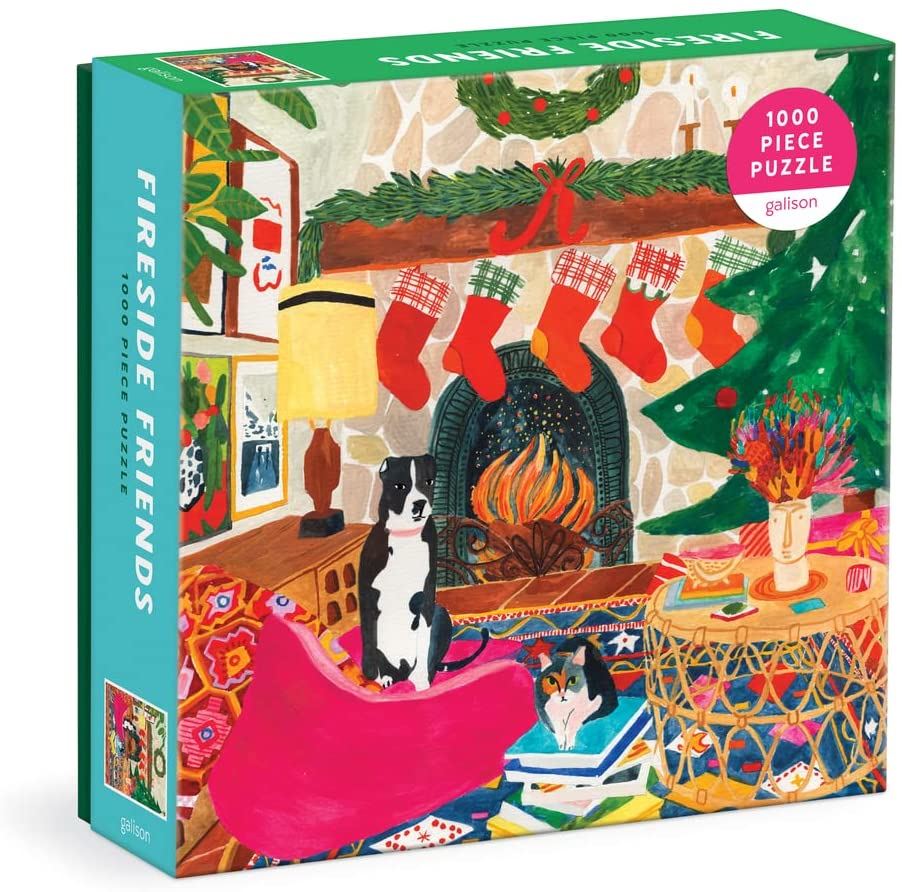 Fireside Friends puzzle box with a festive scene featuring a fireplace, stockings, a cat and a dog.