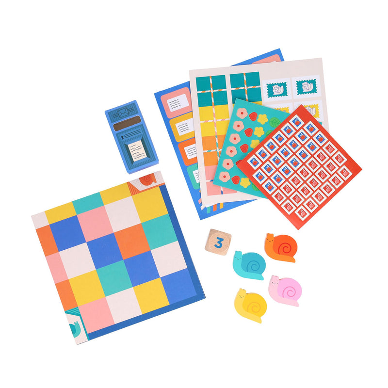 Colorful geometric patterned cards and small toys on a white background