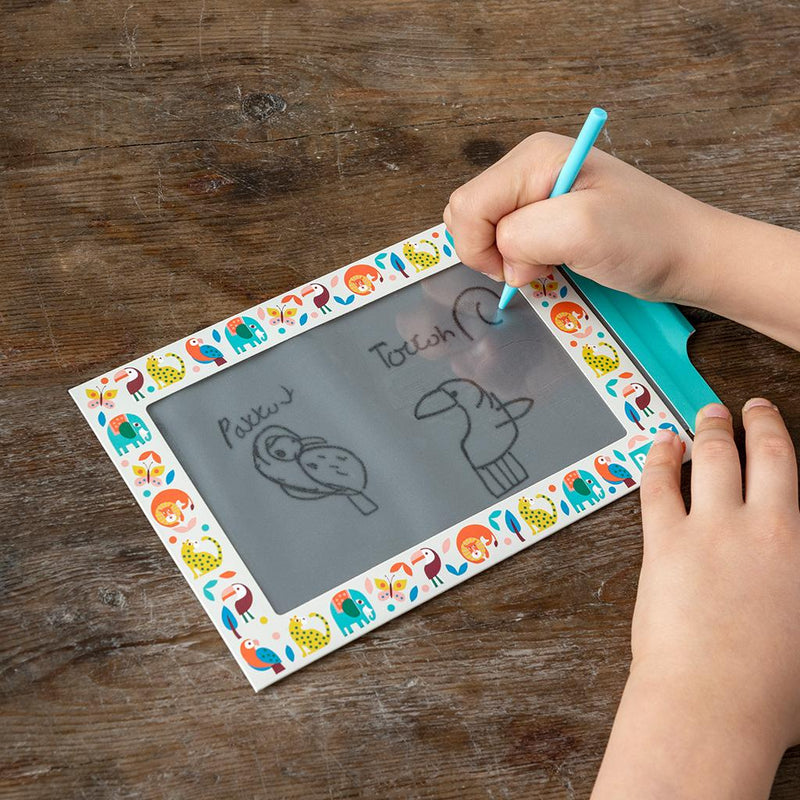 Childs hands drawing on the Wild Wonders Magic Slate